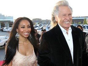 Peter Nygard (R) and Felicia Gomez arrive at a fashion show for his fall collection in Winnipeg Friday September 23, 2011. (BRIAN DONOGH/QMI AGENCY)