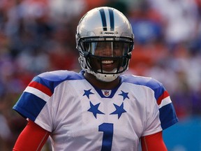 NFC quarterback Cam Newton of the Carolina Panthers smiles after a play during the fourth quarter of the NFL Pro Bowl at Aloha Stadium in Honolulu, Hawaii Jan. 29, 2012. (REUTERS/Hugh Gentry)