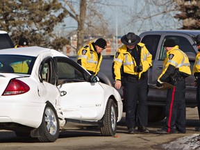 Police investigate a fatal crash at 23 Avenue and 98 Street. (AMBER BRACKEN/EDMONTON SUN)