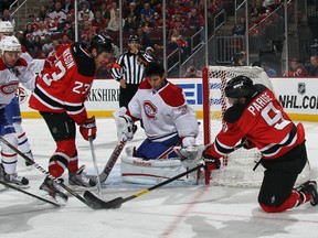 Devils forwards David Clarkson and Zach Parise attempt to score on Canadiens goaltender Carey Price at the Prudential Center in Newark, N.J., Feb. 2, 2012. (BRUCE BENNETT/Getty Images/AFP)