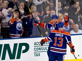 Ryan Whitney celebrates his goal against the Blackhawks with Cam Barker Thursday at Rexall Place. (Codie McLachlan, Edmonton Sun)