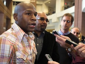Floyd Mayweather Jr. speaks to the media after a Nevada State Athletic Commission licensing hearing in Las Vegas, Nev., Feb. 1, 2012. (STEVE MARCUS/Reuters/Las Vegas Sun)