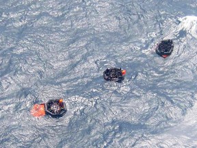 Life rafts carrying survivors float on rough waters after the MV Rabaul Queen ferry sank off Papua New Guinea February 2, 2012. (REUTERS/Papua New Guinea Post Courier)