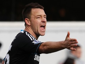 Chelsea's John Terry reacts during their FA Cup match against Queens Park Rangers at Loftus Road in London on Jan. 28, 2012. (REUTERS/Eddie Keogh)