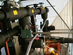 An emergency reactor water injection pump is seen inside a car covered against freeze at the crippled Fukushima Daiichi nuclear plant in Fukushima prefecture, in this handout picture taken February 1, 2012. (Handout)