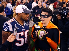 Patriots linebacker Tracy White is interviewed by superhero Nick Boy from Nicktoons during Tuesday's media day at Lucas Oil Stadium in Indianapolis, one of many bizarre things that stood out for Steve Simmons during Super Bowl Week. (Reuters)