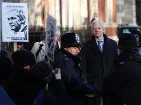 Wikileaks founder Julian Assange arrives at the Supreme Court in Westminster, on the second day of his extradition appeal, in central London, February 2, 2012. WikiLeaks founder Julian Assange appealed to Britain's Supreme Court not to extradite him to Sweden over accusations of sex crimes, a move that could push his anti-secrecy website further towards oblivion.  REUTERS/Andrew Winning (BRITAIN - Tags: POLITICS CRIME LAW SOCIETY)