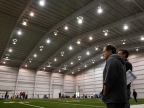 New England Patriots head coach Bill Belichick looks on during a practice for Super Bowl XLVI in Indianapolis,