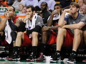 Toronto Raptors' Jerryd Bayless (L-R), Jose Calderon, Amir Johnson, and Aaron Gray watch the final moments of their miserable outing in Boston Wednesday night. (REUTERS)
