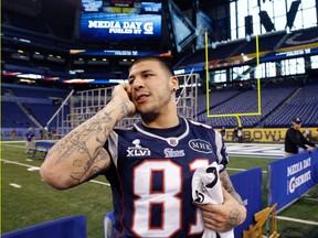 New York Giants tight end Aaron Hernandez talks on his phone during Super Bowl media day earlier in the week. (REUTERS)