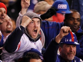 New York Giants fans celebrate their team's overtime win over San Francisco in the NFC Championship. (REUTERS)