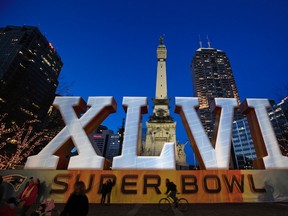 A mural is set up as part of Super Bowl XLVI festivities in Indianapolis. But there's just as much happening in Las Vegas, where bettors are hoping to rake in the cash on Sunday. (REUTERS)