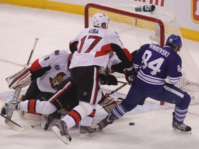 Maple Leafs Mikhail Grabovski tries to score on the Senators during first period action Saturday night in Ottawa.  (QMI AGENCY)