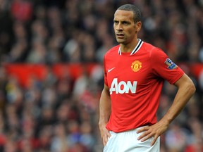 Manchester United's English defender Rio Ferdinand is troubled by the abuse heaped on his brother, Anton, as a result of the John Terry racism case. (AFP PHOTO)