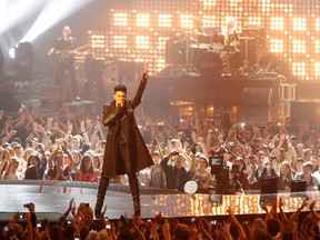 Singer Adam Lambert (dark coat) performs with "Queen", at The MTV Europe Music Awards 2011 (EMAs). - Ian Wilson/WENN.COM
