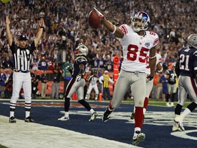 New York Giants David Tyree celebrates his touchdown during the fourth quarter of the NFL's Super Bowl XLII football game against the New England Patriots in Glendale, Arizona Feb. 3, 2008. (REUTERS/Shaun Best)