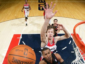 Raptors guard Leandro Barbosa goes for a layup in front of Wizards forward  Jan Vesely during Monday's game in Washington.