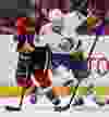 Ottawa Senator Zenon Konopka battles with New York Islander Tim Wallace during second period NHL hockey action at Scotibank Place in Ottawa, Ontario. Thursday February 3,2012. (ERROL MCGIHON/THE OTTAWA SUN/QMI AGENCY).