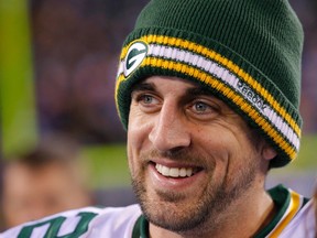 Green Bay Packers quarterback Aaron Rodgers smiles after the Packers defeated the New York Giants in their NFL football game in East Rutherford, New Jersey, Dec. 4, 2011. (REUTERS/Mike Segar)