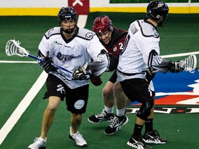Brett Mydske is harassed by Colorado's Creighton Reid during the Edmonton Rush - Colorado Mammoth game at Rexall Place on Jan. 20. The Mammoth downed the Rush Saturday in Denver 11-7.