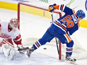 Edmonton Oilers Sam Gagner scores on Detroit Redwings Joey MacDonald during overtime shootout NHL action at Rexall place in Edmonton, Alberta on Saturday, February 4, 2012. (AMBER BRACKEN//QMI AGENCY)