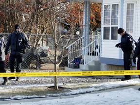 Officers on scene after a 62-year-old woman was attacked last month. TOM BRAID\QMI AGENCY