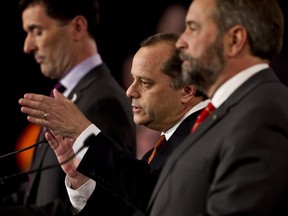 NDP leadership candidates (L-R) Paul Dewar, Brian Topp, and Thomas Mulcair are seen in this file photo. (ERROL MCGIHON/QMI AGENCY)