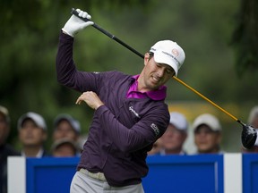 Mike Weir grimaces after hitting his tee shot on the seventh hole during last year's Canadian Open in Vancouver. Weir was forced to retire from the tourney and has since had elbow surgery. He plays his first tournament this week at Pebble Beach. (QMI AGENCY)