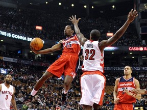 Washington Wizards guard Jordan Crawford goes to the basket against Toronto Raptors forward Ed Davis during Toronto's Friday night win at the ACC. (REUTERS)