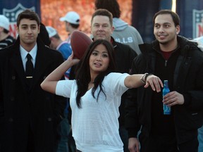 Mae Cantos throws the ball at Toronto’s Sound Academy during the NFL Super Bowl celebration. (DAVE ABEL, Toronto Sun)