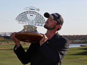 Kyle Stanley kisses the trophy after winning the Waste Management Phoenix Open at TPC Scottsdale in Scottsdale, Ariz., on Sunday. It was his first PGA Tour victory. (GETTY IMAGES)