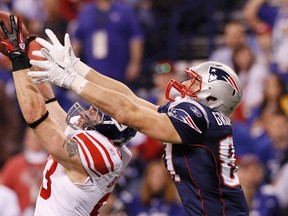 New York Giants middle linebacker Chase Blackburn intercepts a pass intended for New England Patriots tight end Rob Gronkowski during the third quarter of Super Bowl XLVI. (REUTERS)
