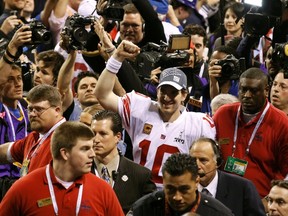 New York Giants quarterback Eli Manning celebrates as he leaves the field after defeating the New England Patriots inSuper Bowl XLVI. (REUTERS)