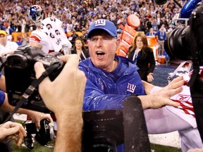 New York Giants head coach Tom Coughlin celebrates after defeating the New England Patriots in Super Bowl XLVI. (REUTERS)