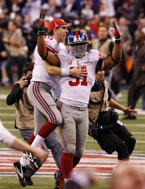New York Giants and MVP quarterback Eli Manning celebrates after defeating  the New England Patriots at Super Bowl XLVI at Lucas Oil Stadium on  February 5, 2012 in Indianapolis. New York beat