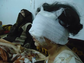 A wounded girl is seen in Baba Amro, a neighbourhood of Homs February 6, 2012. (REUTERS/Handout)