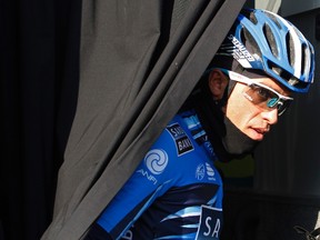 Saxo Bank-Sungard rider Alberto Contador leaves the team bus before the start of the first stage of the Challenge Mallorca cycling tour in Palma de Mallorca on the Spanish Balearic island Feb. 5, 2012.  (REUTERS/Enrique Calvo)