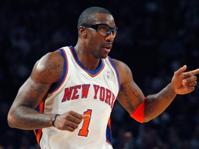 New York Knicks Amar'e Stoudemire reacts after scoring a basket against the Boston Celtics in the first half during their NBA basketball game in New York Dec. 25, 2011. (REUTERS/Eduardo Munoz)