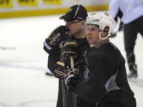 Penguins forward Sidney Crosby and head coach Dan Bylsma during practice at the Bell Centre in Montreal, Que., Feb. 6, 2012. (JOCELYN MALETTE/QMI Agency)