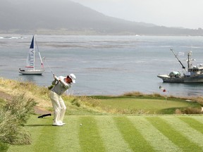 Graeme McDowell of Northern Ireland hits his tee shot on the seventh hole during the final round of the 2010 U.S. Open at Pebble Beach Golf Links. The PGA Tour stops at the jaw-dropping course this week. (GETTY IMAGES)