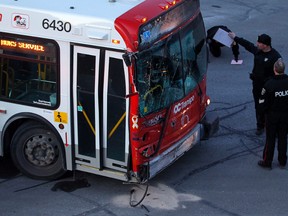 A dozen people suffered minor injuries after two OC Transpo buses collided on the Transitway at Tunney's Pasture around rush hour Tuesday, February 7, 2012.  (DARREN BROWN/QMI AGENCY)