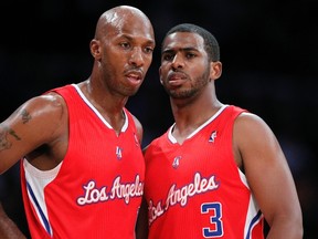 Los Angeles Clippers players Chris Paul (right) and Chauncey Billups talk during a game earlier this year. Billups tore his ACL this week and will miss the remainder of the NBA season. (REUTERS)