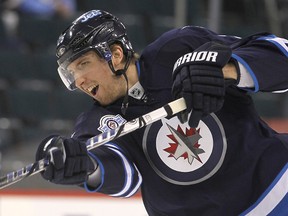 Jets forward Blake Wheeler fires a shot during the warmup prior to facing the Devils at the MTS Centre in Winnipeg, Man., Jan. 14, 2012. (BRIAN DONOGH/QMI Agency)