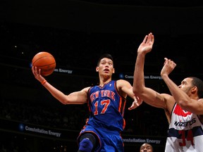 Knicks guard Jeremy Lin shoots against Wizards centre JaVale McGee at the Verizon Center in Washington, D.C., Feb. 8, 2012. (NED DISHMAN/NBAE via Getty Images/AFP)