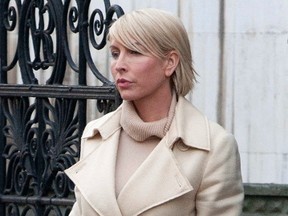 Heather Mills leaves the Leveson Inquiry at the High Court in central London February 9, 2012. (REUTERS/Neil Hall)