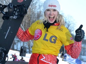 Canadian snowboarder Dominique Maltais gives a big thumbs up as she heads to the podium following her victory in the women's snowboard-cross world cup event at Blue Mountain on Wednesday, Feb. 8, 2012. (James Masters/QMI Agency)