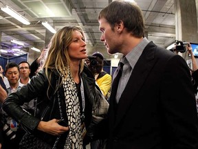 Supermodel Gisele Bundchen speaks to Patriots quarterback Tom Brady after losing to the Giants at Super Bowl XLVI on Feb. 5, 2012 in Indianapolis. (Rob Carr/Getty Images/AFP)