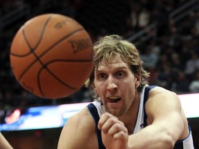 Mavericks forward Dirk Nowitzki eyes a loose ball during a game against the Cavaliers in Cleveland, Ohio, Feb. 4, 2012. (AARON JOSEFCZYK/Reuters)