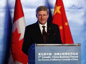 Canada's Prime Minister Stephen Harper delivers a speech during the 5th Canada-China Business Forum in Beijing Feb. 9, 2012.      (REUTERS/Chris Wattie)