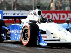 Paul Tracy, seen here racing during a warm-up for last summer's Edmonton Indy, won't be receiving a much-needed subsidy from IndyCar this season. Nor will Quebec's Alex Tagliani. (QMI AGENCY)